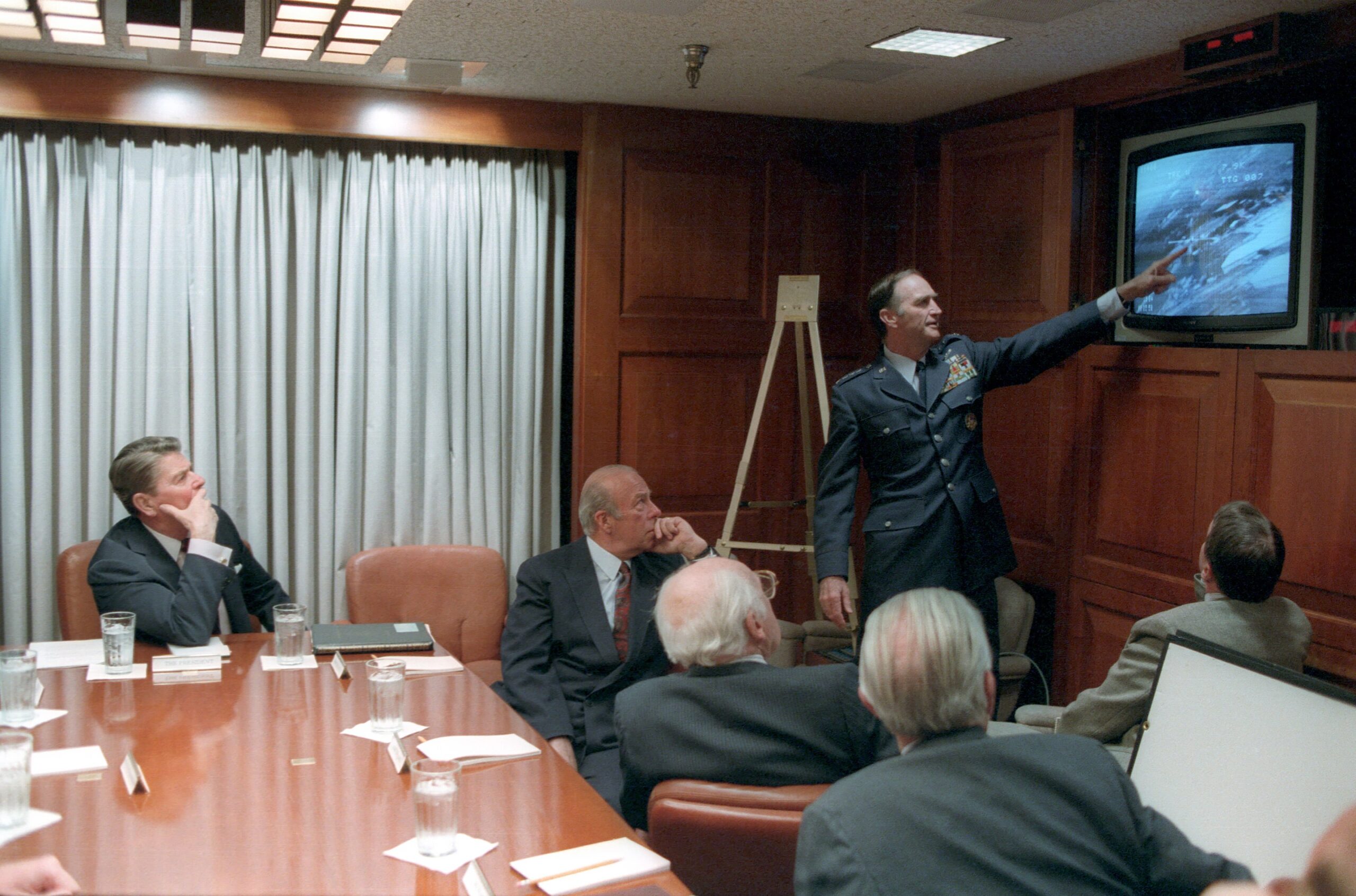 President_Ronald_Reagan_being_briefed_by_the_National_Security_Council_staff